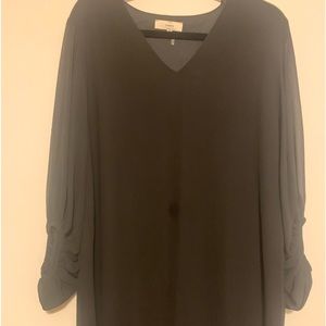 Above Knee Black flowing dress with bell sleeves. Sheer that is fully lined
